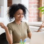 Young woman meditating at work, mental health concept