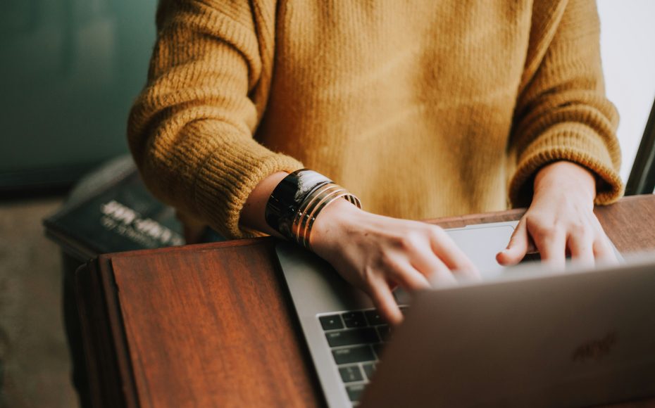person typing on laptop