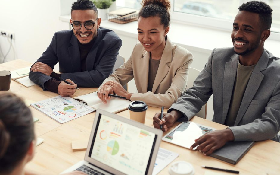 workers smiling around table