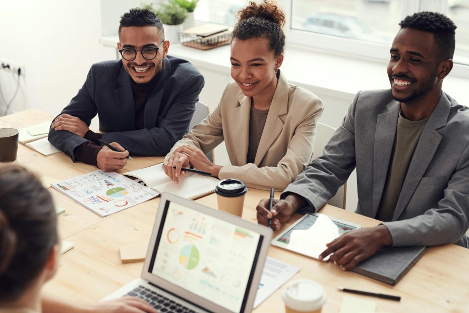workers smiling around table