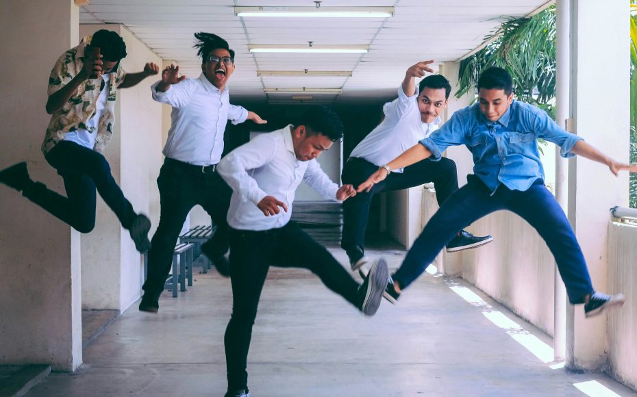 employees jumping off the ground